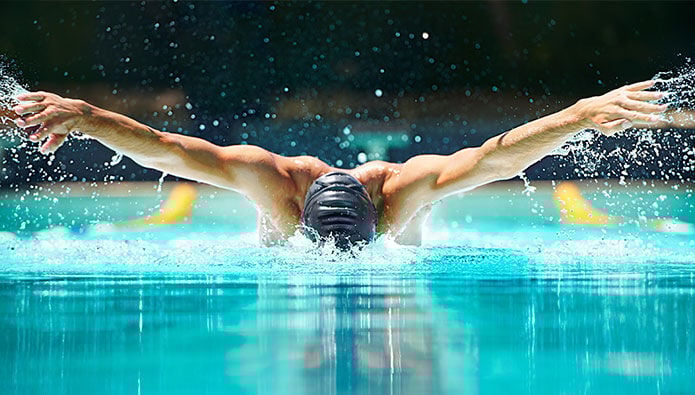 A man swimming laps A man swimming laps
