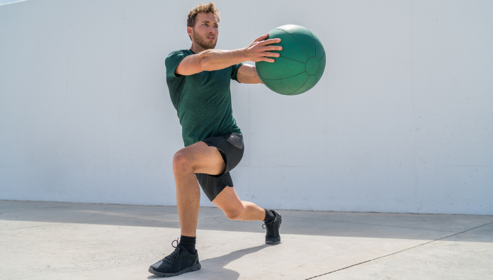Man working out with a small workout ball