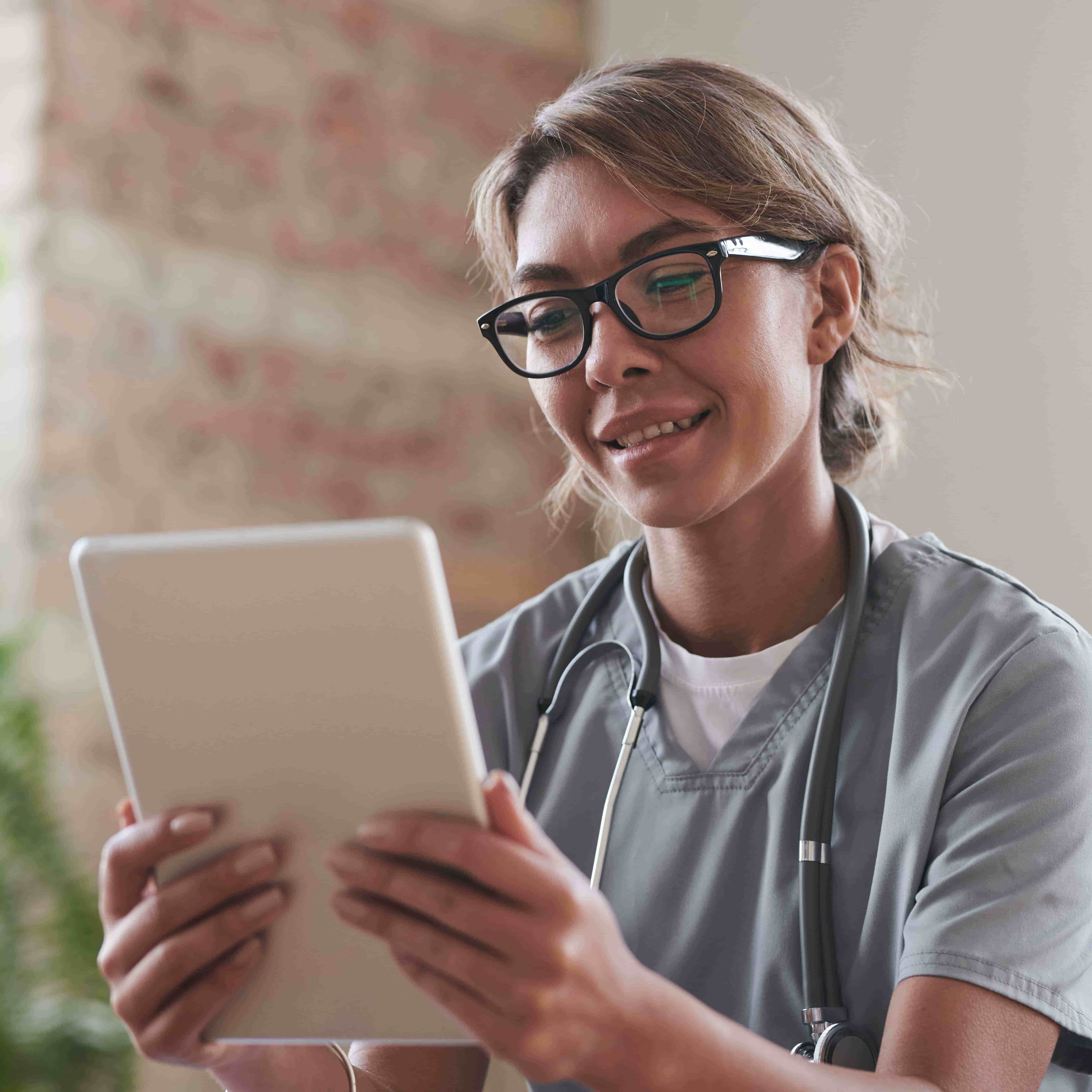 health professional looking at ipad