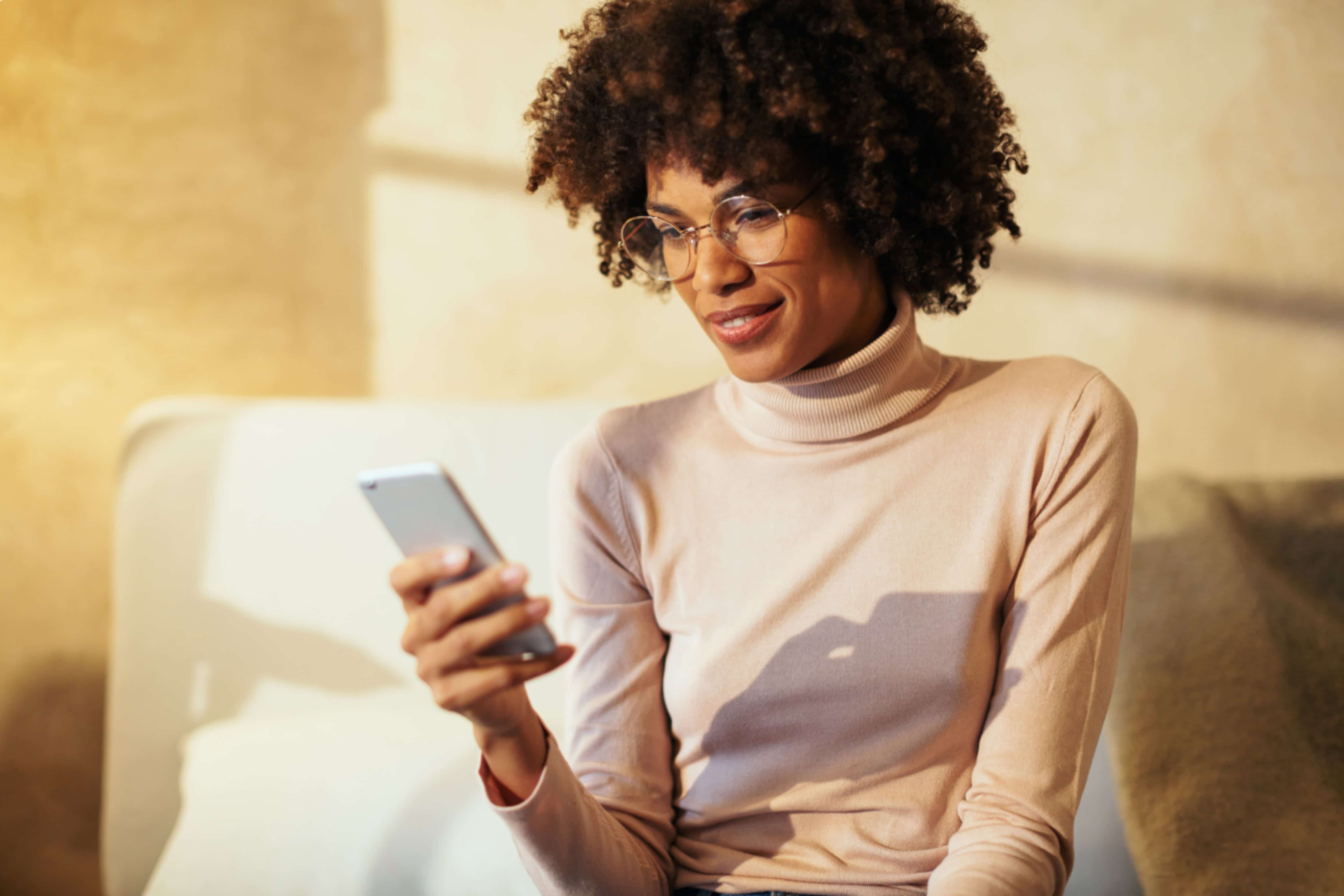 woman accessing her test results on her phone